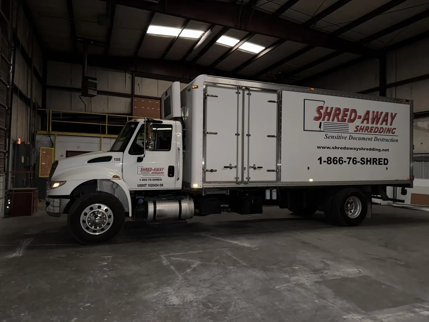 A Shred-Away box truck in the company maintenance bay.
