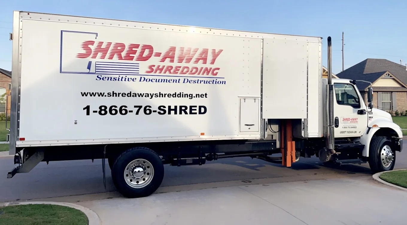 A Shred-Away shredding truck photographed at golden hour.